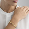 GEORG JENSEN - ARMRING, TORUN BANGLE GULT GULL MED DIAMANTER 0,08 CT. - STYLING HENNE
